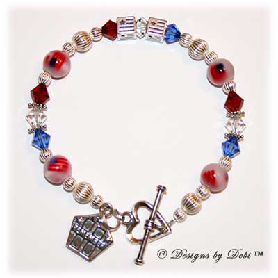 Designs by Debi Handmade Jewelry Personalized Remember 9/11 Bracelet Flags with red, white and blue Swarovski crystals, sterling silver and fiber optic flag beads, a heart toggle clasp and Remember charm with the Twin Towers and stars.